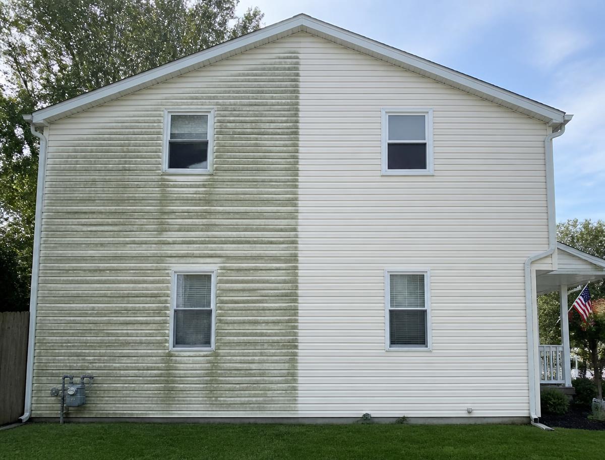 House siding half dirty and half cleaned after soft washing